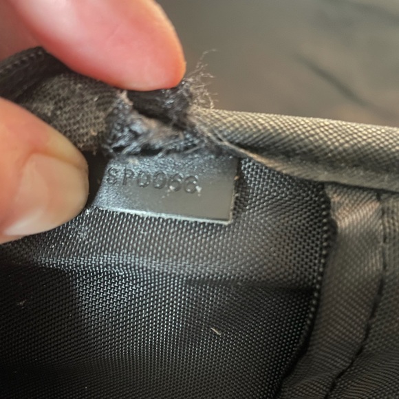 This is a Louis Vuitton travel bag black. - Picture 16 of 16